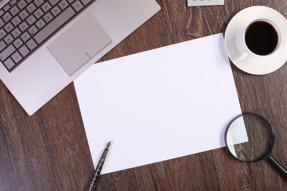 Business papers and a cup of coffee on the table